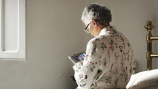 A woman looking at a photo